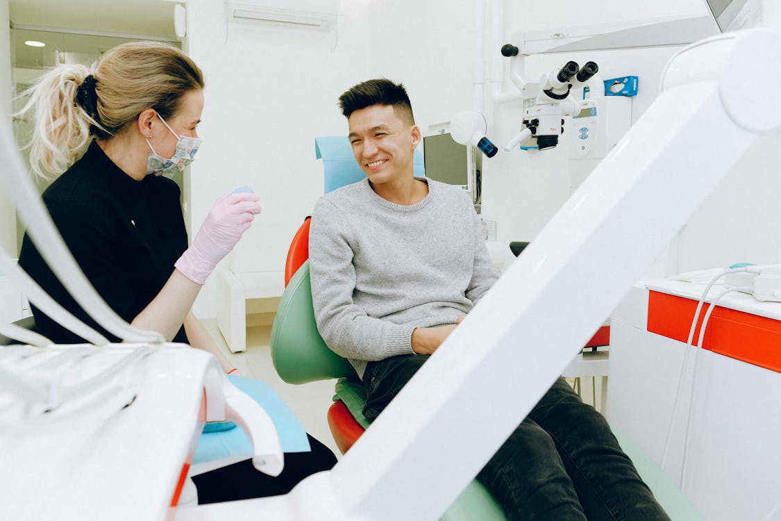 Free Man Sitting on Dental Chair Stock Photo