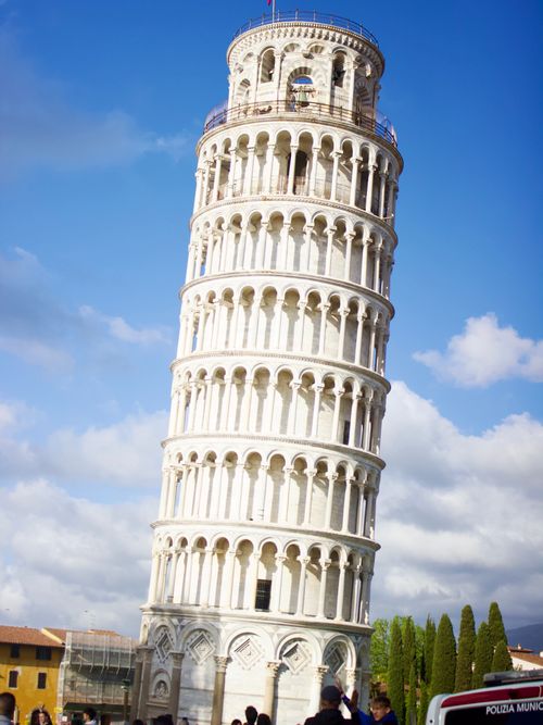 Free The iconic Leaning Tower of Pisa against a clear blue sky. Stock Photo