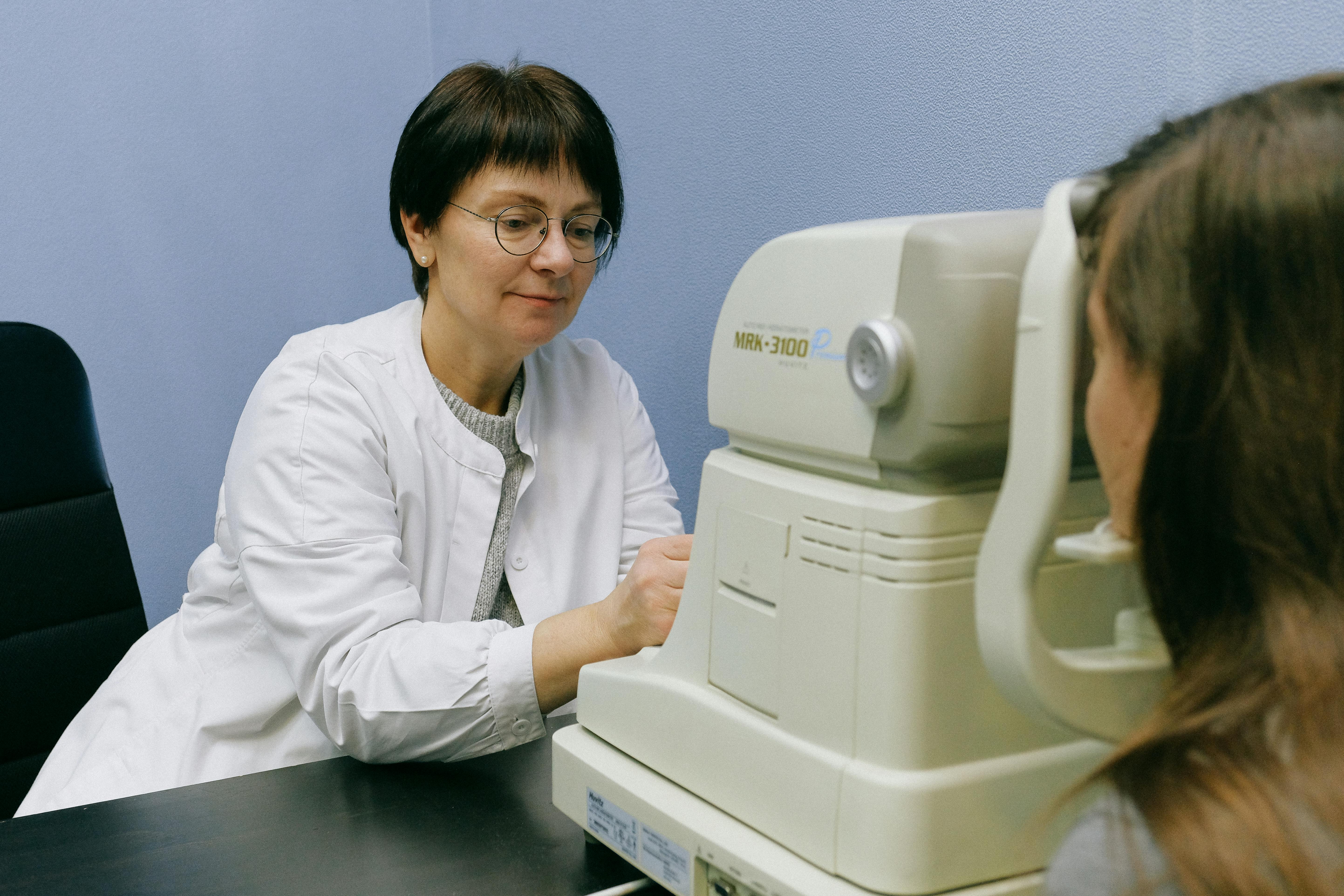 photo of opthalmologist checking on a patient