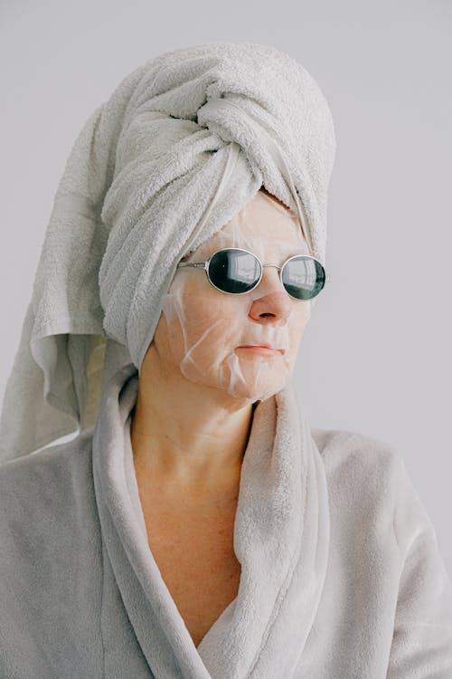 Free Serious woman in bathrobe and towel Stock Photo