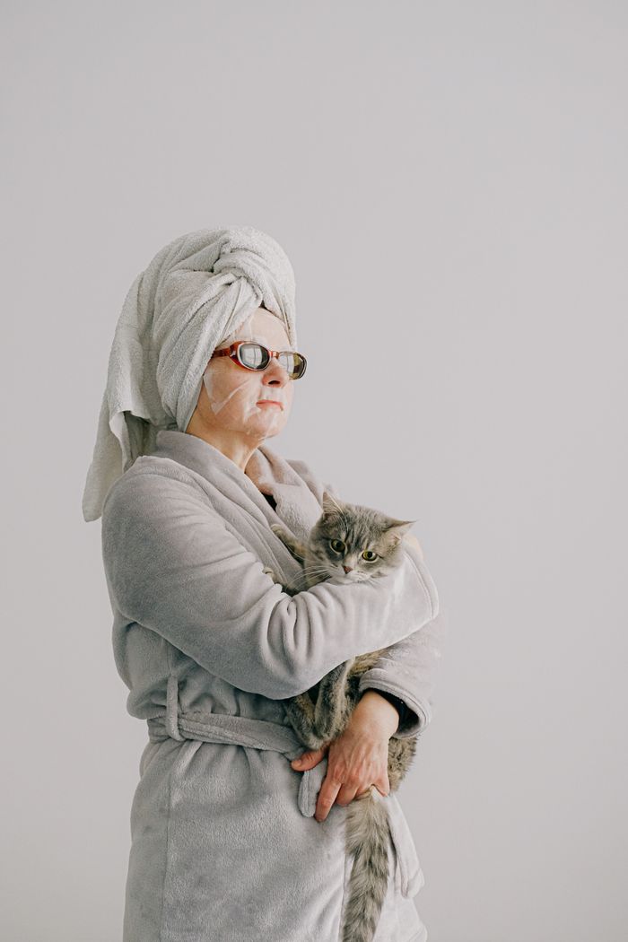 Pet parent spending time with a cat