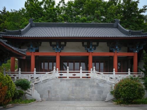 Free Beautiful view of traditional Asian architecture surrounded by lush greenery and garden. Stock Photo