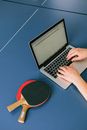 Person Using Macbook Pro on Blue Table