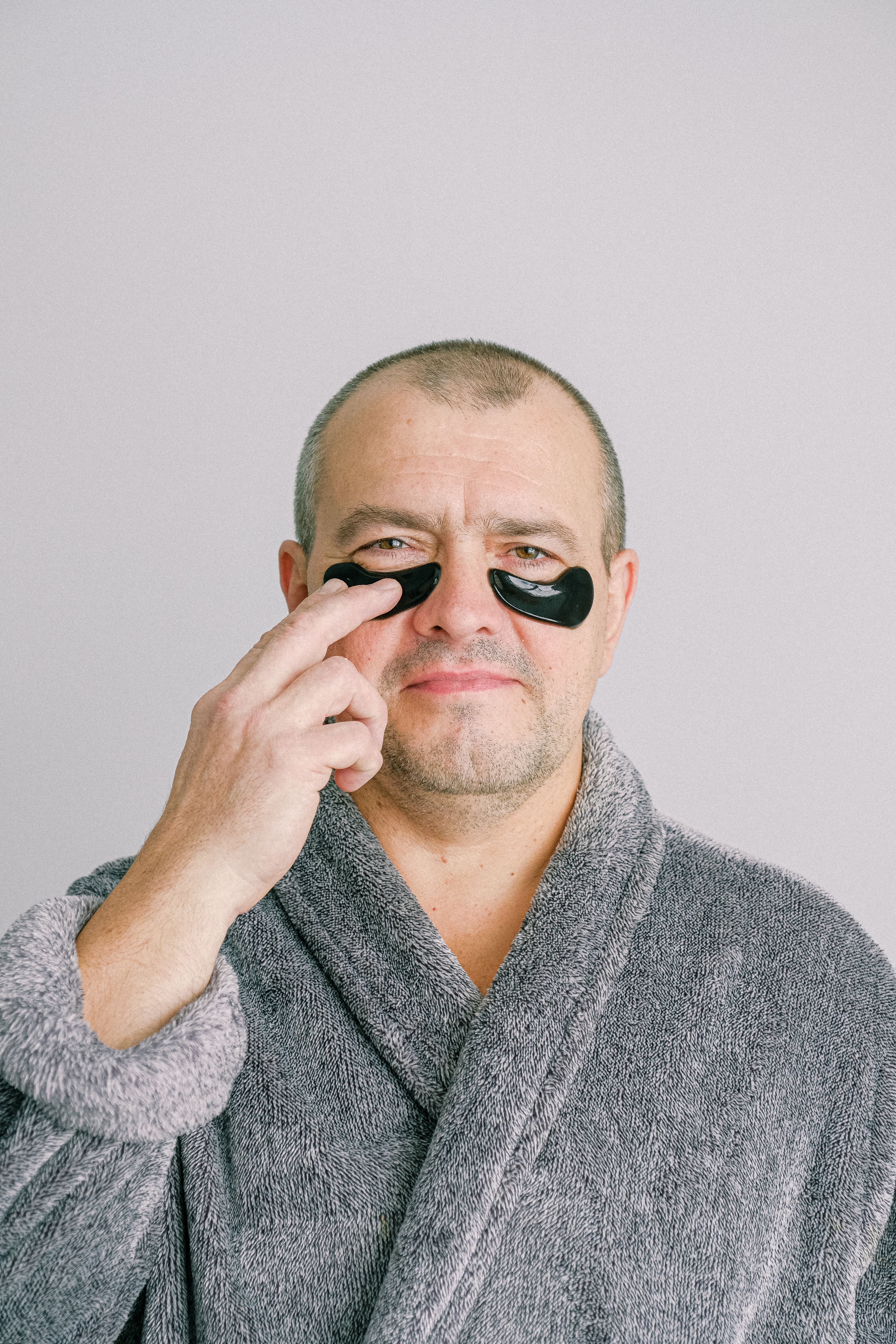 Man in Gray Bathrobe Wearing Black Eye Mask · Free Stock Photo