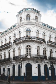A beautifully preserved colonial building in Cuenca, Ecuador, showcasing intricate architectural details.
