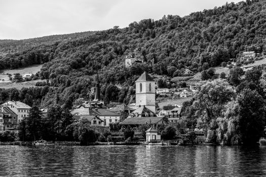 Beautiful black and white landscape of Twann, Switzerland with historic architecture and lush greenery.