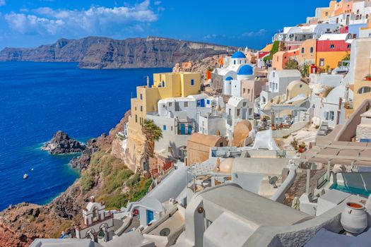 Charming view of Santorini's iconic white and blue architecture overlooking the Aegean Sea.