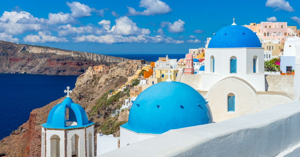 Blue-domed churches above the caldera at Oia, Santorini