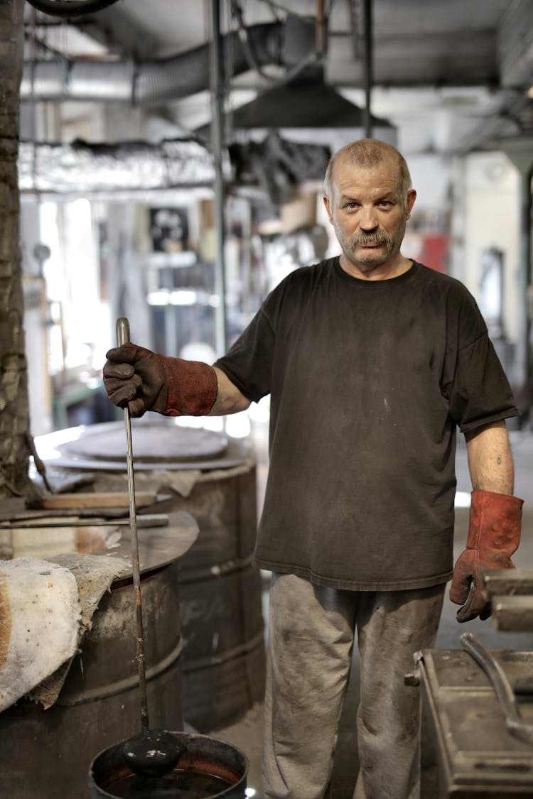 Serious Elderly Worker Showing Results Of Labour