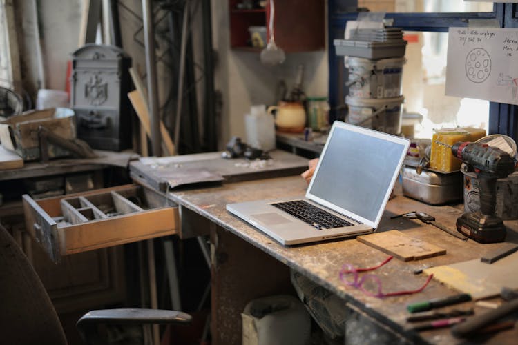 Laptop On Table In Workshop