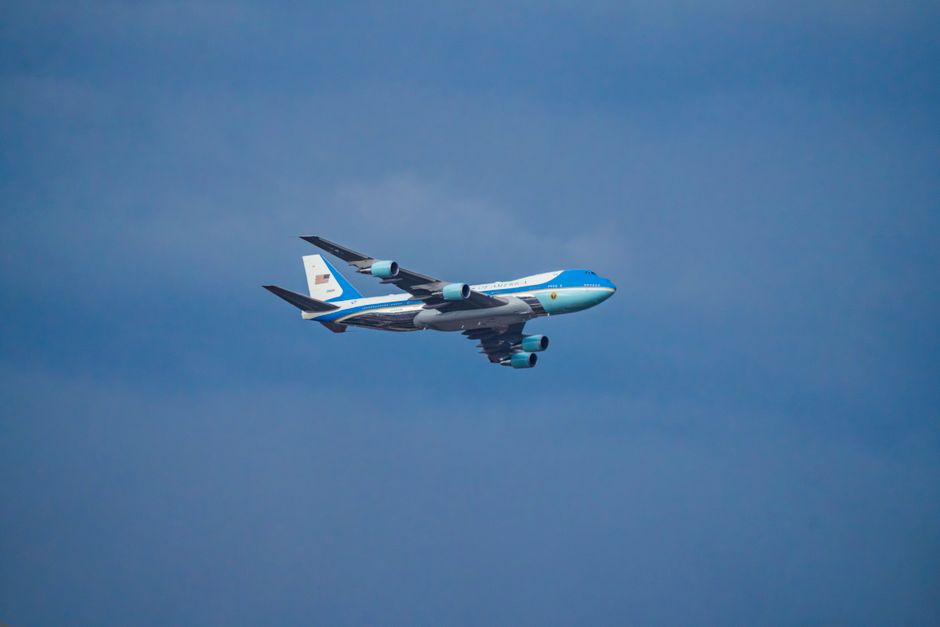 Air Force One airplane flying in the clear blue sky over Washington, DC.