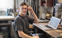 Man In Black Crew Neck T-shirt Sitting On Chair