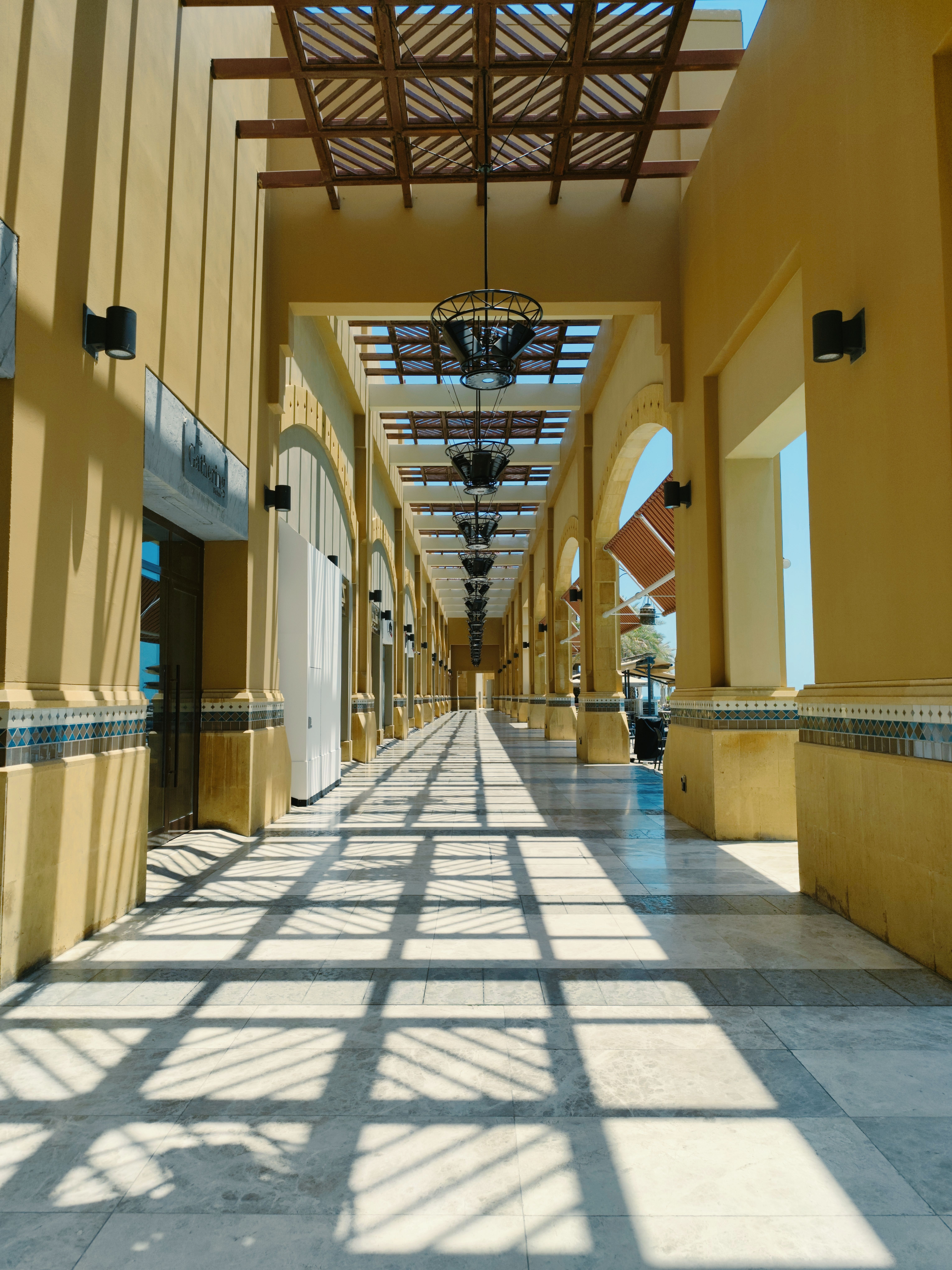 architectural hallway with geometric light and shadow
