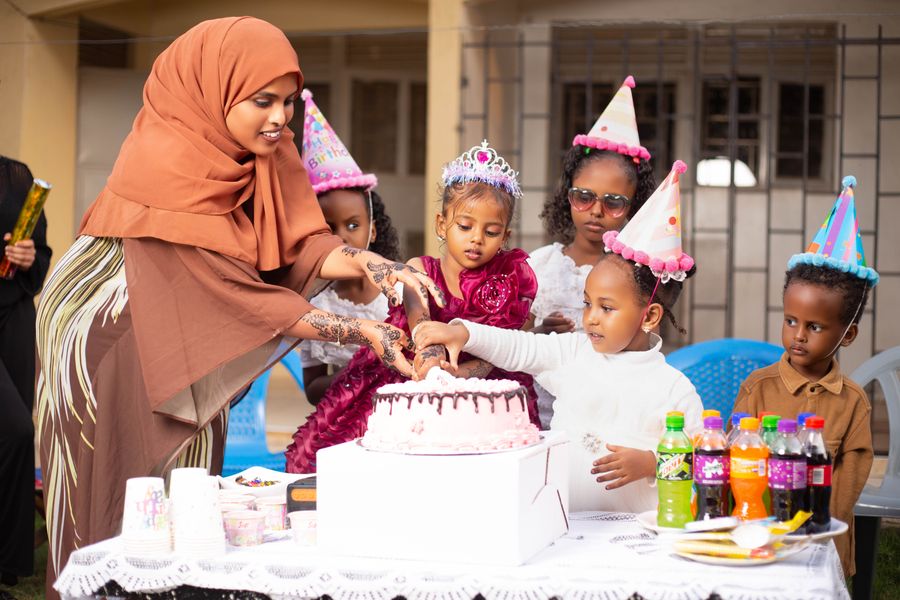 Cutting the birthday cake together