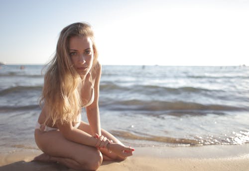 Woman Sitting On Beach