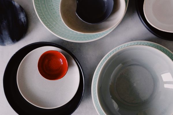 Flat lay of glazed bowls and plates, photo by ready made on Pexels