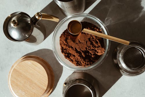 Stainless Steel Spoon on Brown Coffee Powder