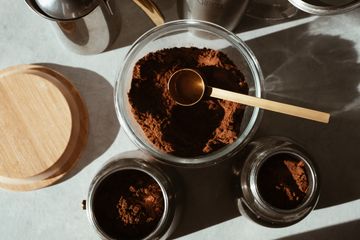Coffee jar on a dark background, photo by ready made on Pexels