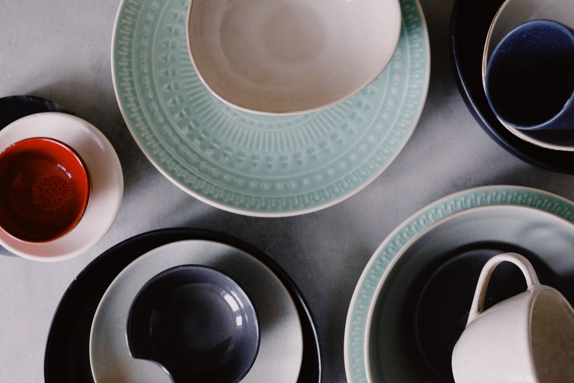 Stacked Costco kitchen bowls in a cupboard with clean, elegant design