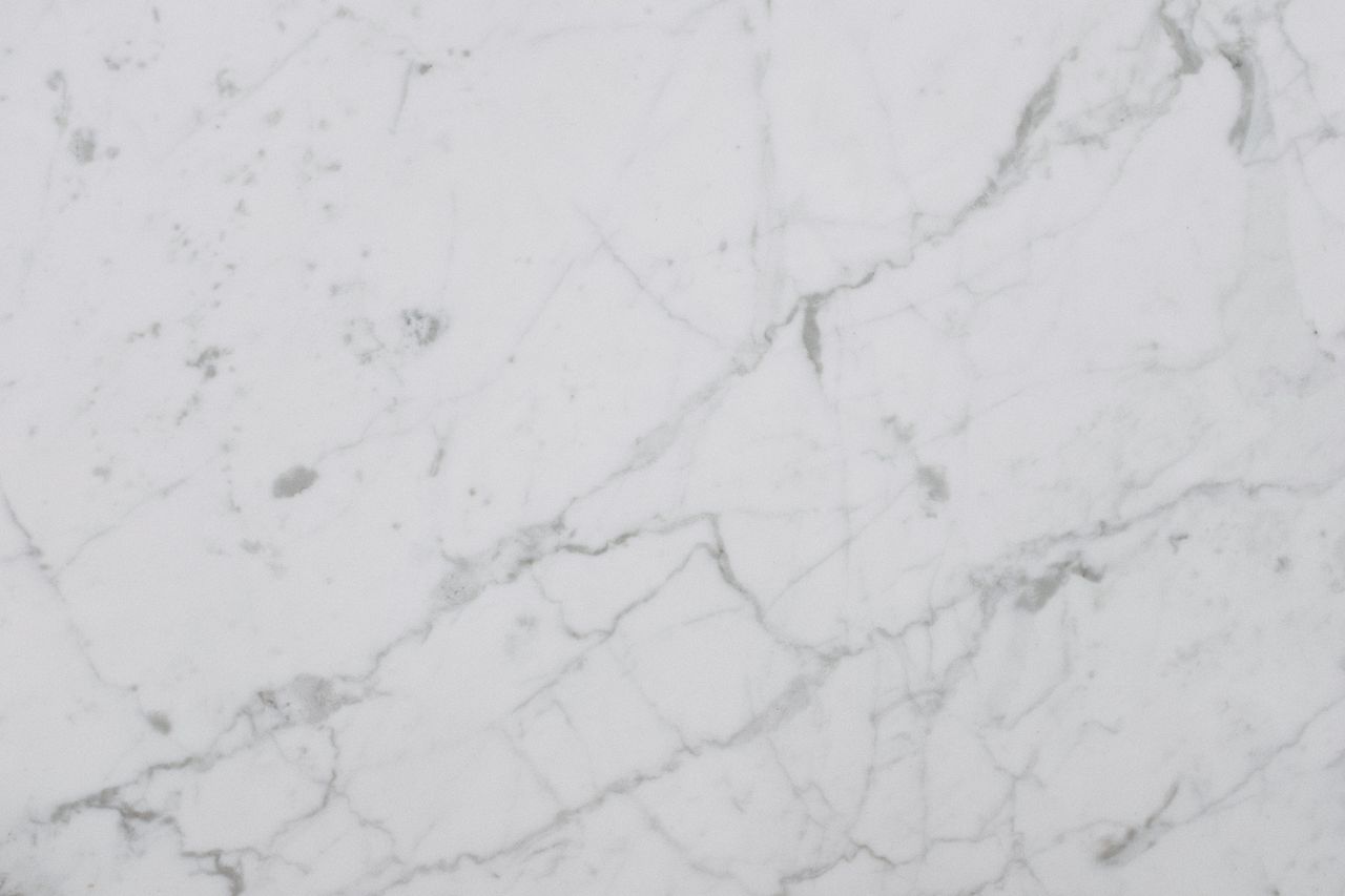 smooth white marble surface showing natural veining and texture perfec
