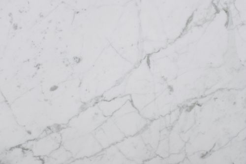 Free Smooth white marble surface showing natural veining and texture, perfect for design backgrounds. Stock Photo