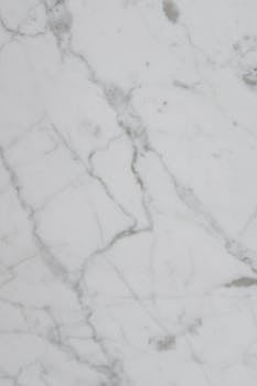 Smooth white marble texture ideal for backgrounds and designs.