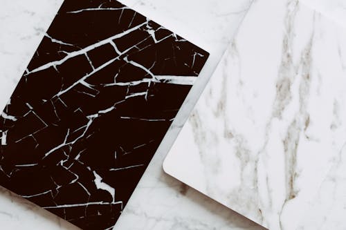 Trendy marble styled planners on table