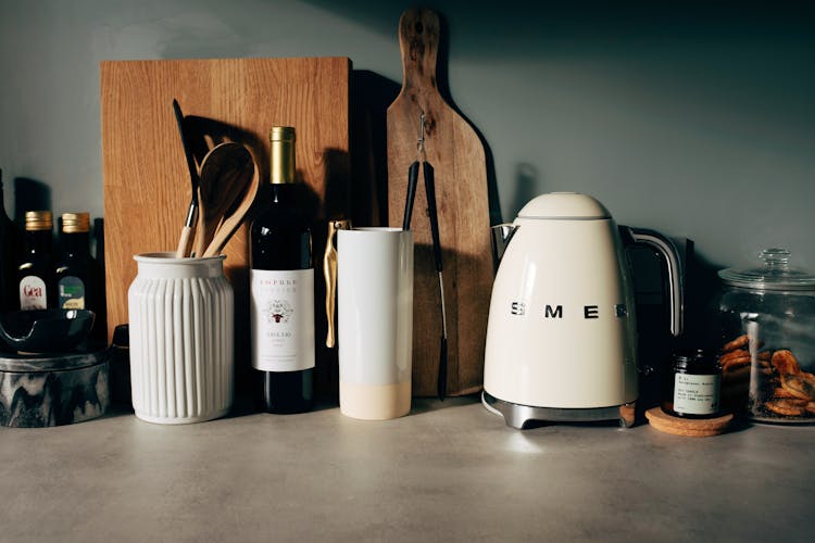 Kitchenware On Stone Counter In Modern Kitchen