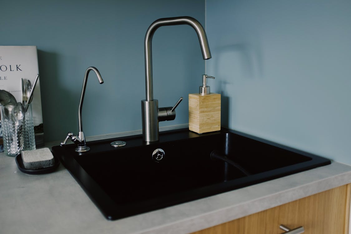 smart home features - Kitchen sink where water leaks usually occurs | Photo by ready made from Pexels