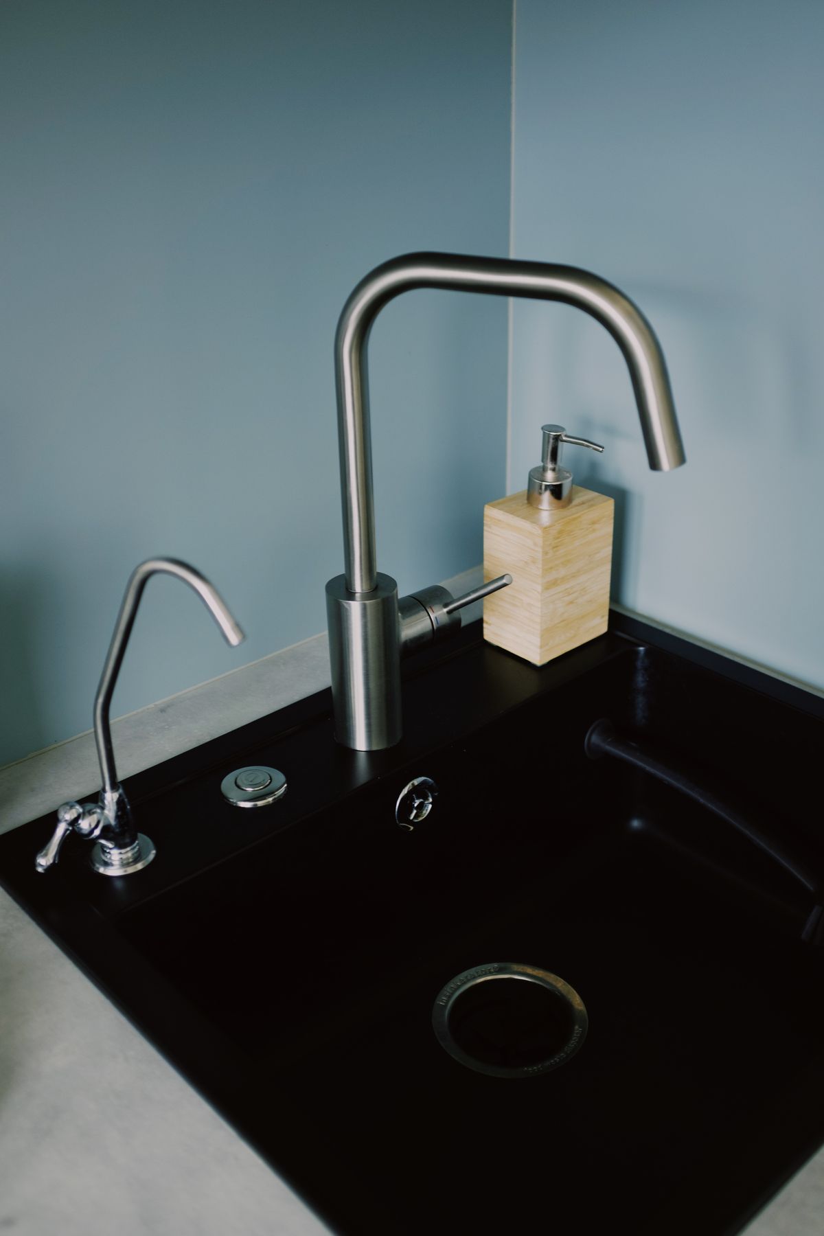 Modern stainless steel kitchen faucet with soap dispenser, the type of fixture available in touchless models