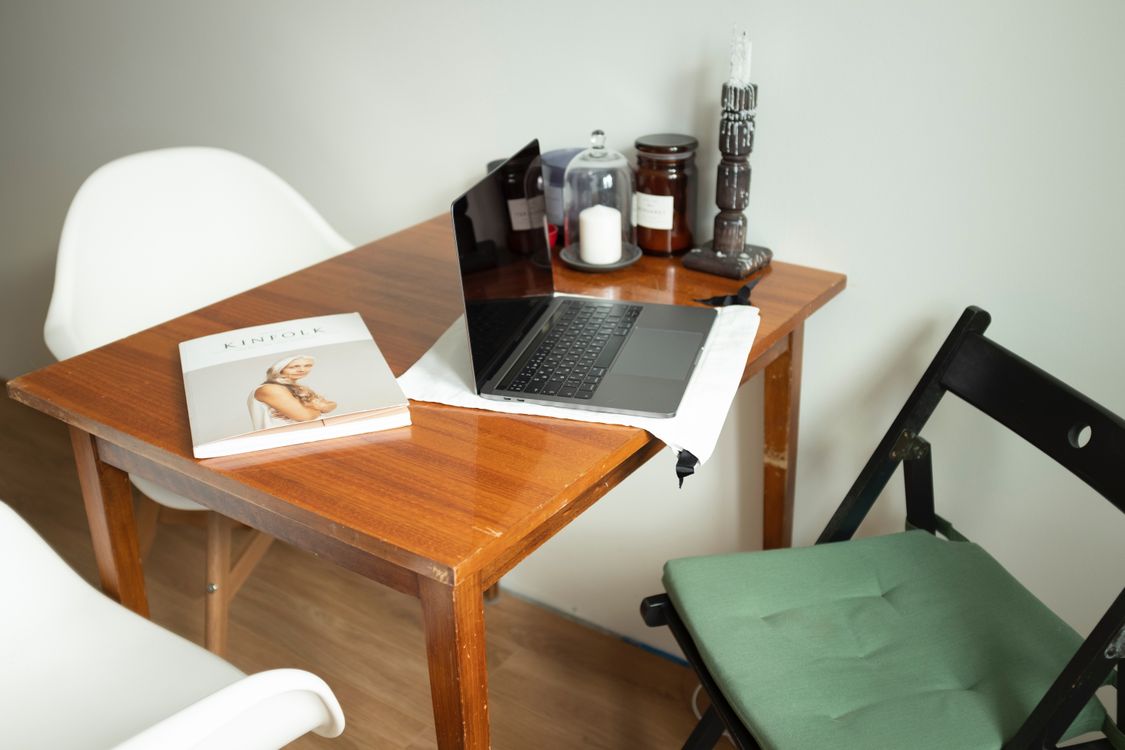 Silver Macbook Pro on Brown Wooden Table · Free Stock Photo
