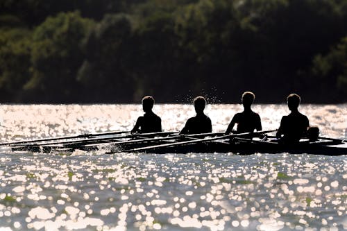 Free People Rowing in Boat Stock Photo