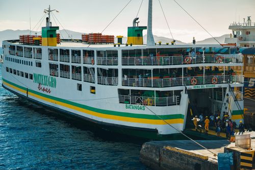 Free A bustling ferry docking at Batangas port with passengers disembarking. Stock Photo