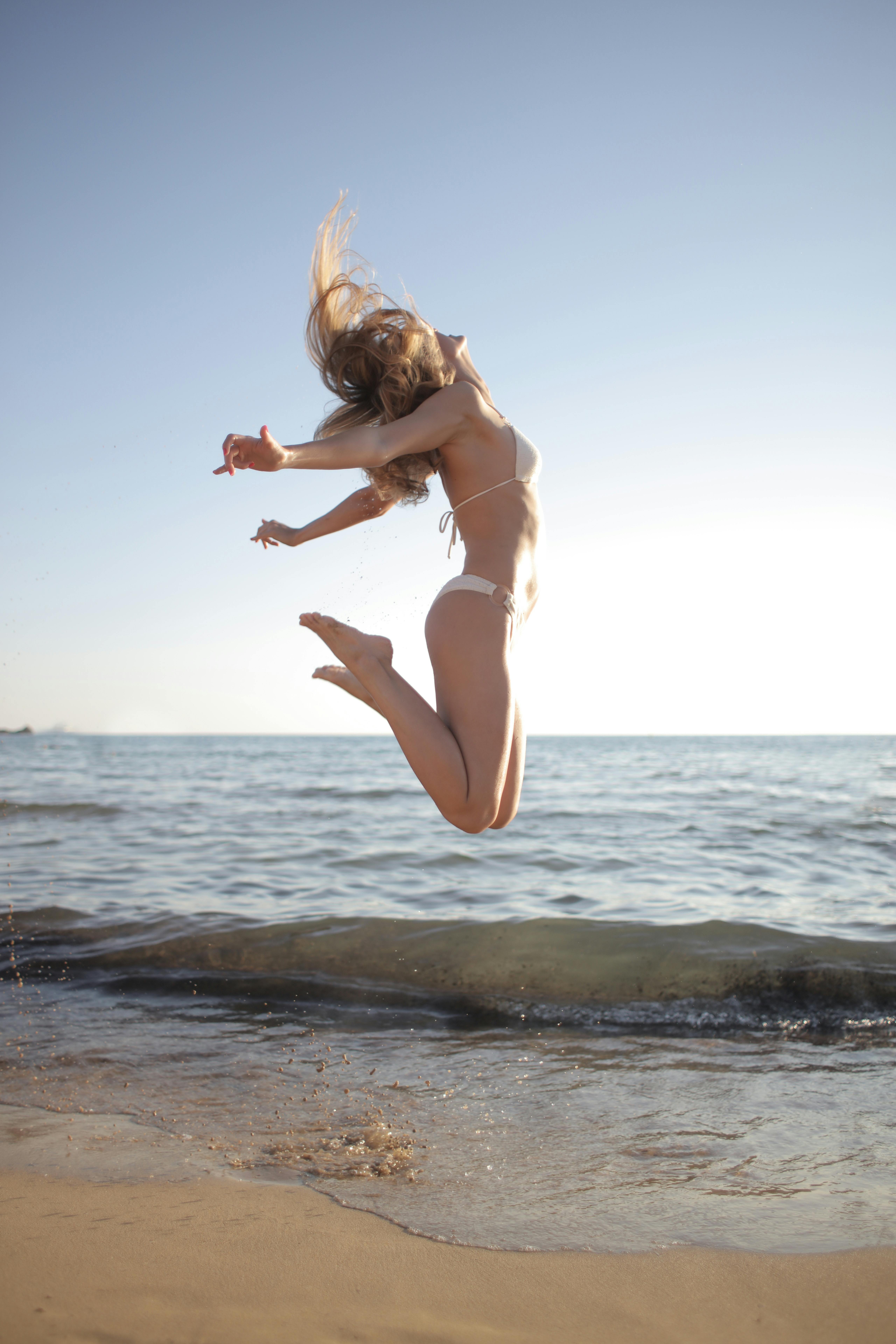 happy woman enjoying sun on beach