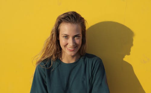 Woman In Blue Crew Neck Shirt Smiling