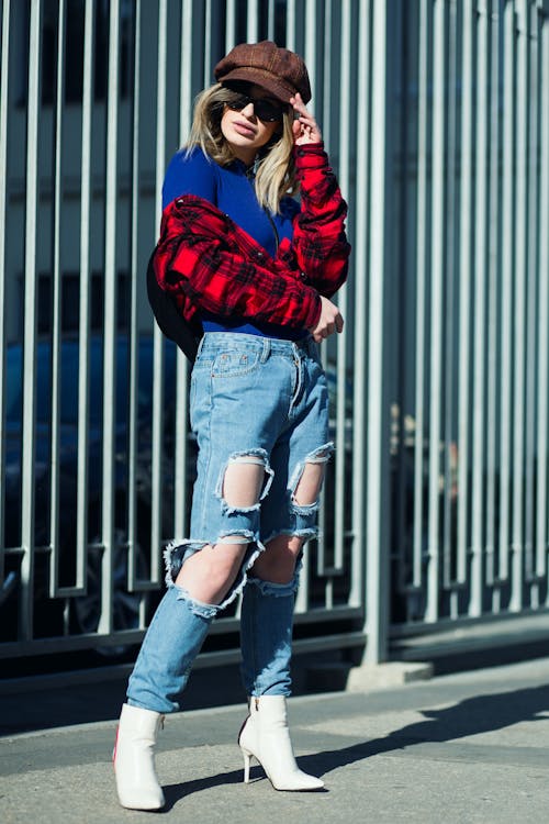 Woman In Red Jacket And Blue Denim Jeans 