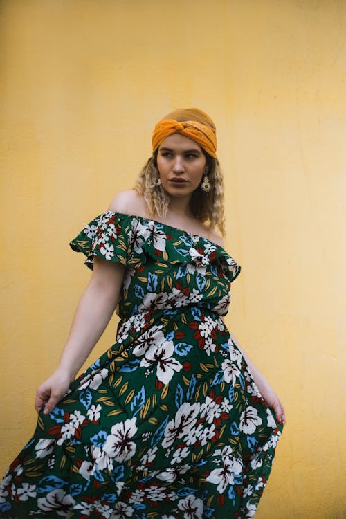 Woman Wearing Floral Off-shoulder Dress and Orange Headscarf