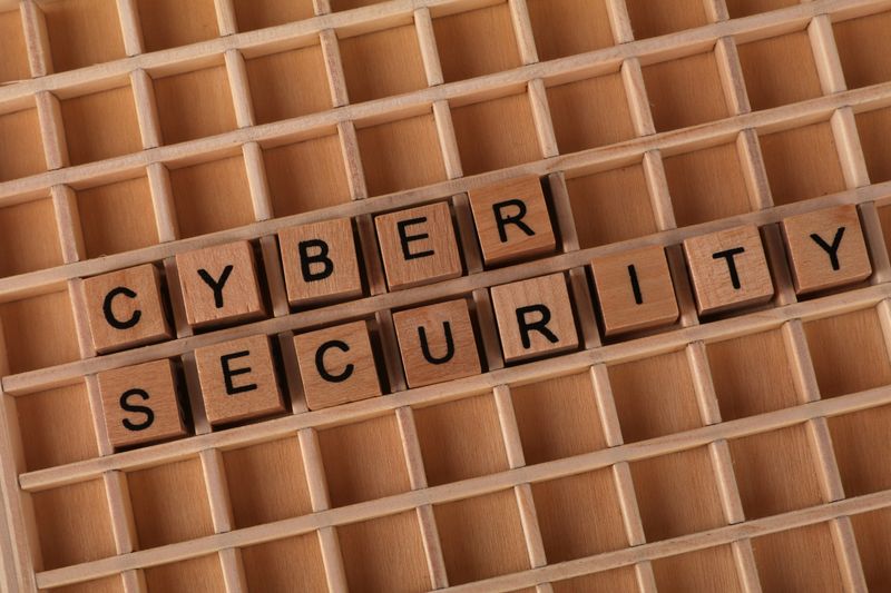 Wooden tiles spelling cyber security