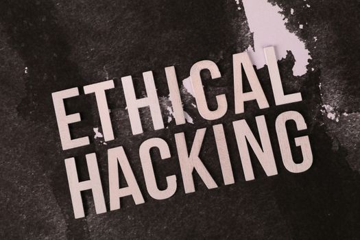 Creative depiction of the term 'Ethical Hacking' on a dark artistic background.