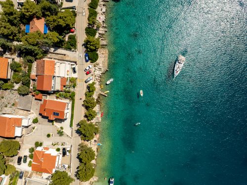 Free A stunning aerial view over Rogoznica, Croatia, showcasing the coastline and boats along the clear blue Adriatic Sea. Stock Photo