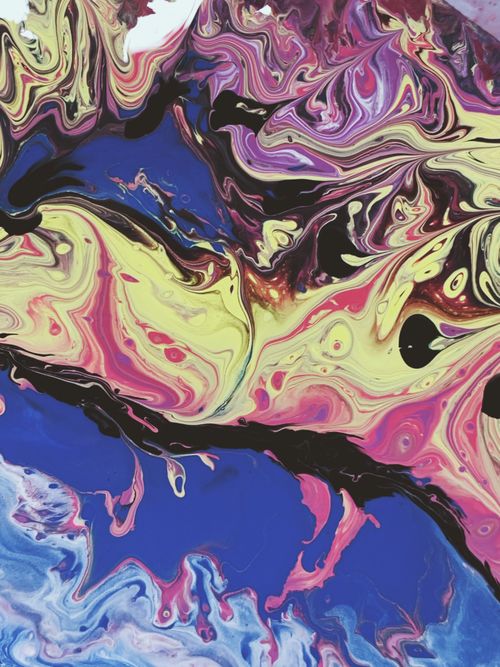 Free From above of bright modern oil artwork representing intense blue water and mixed of colorful lines and swirls Stock Photo