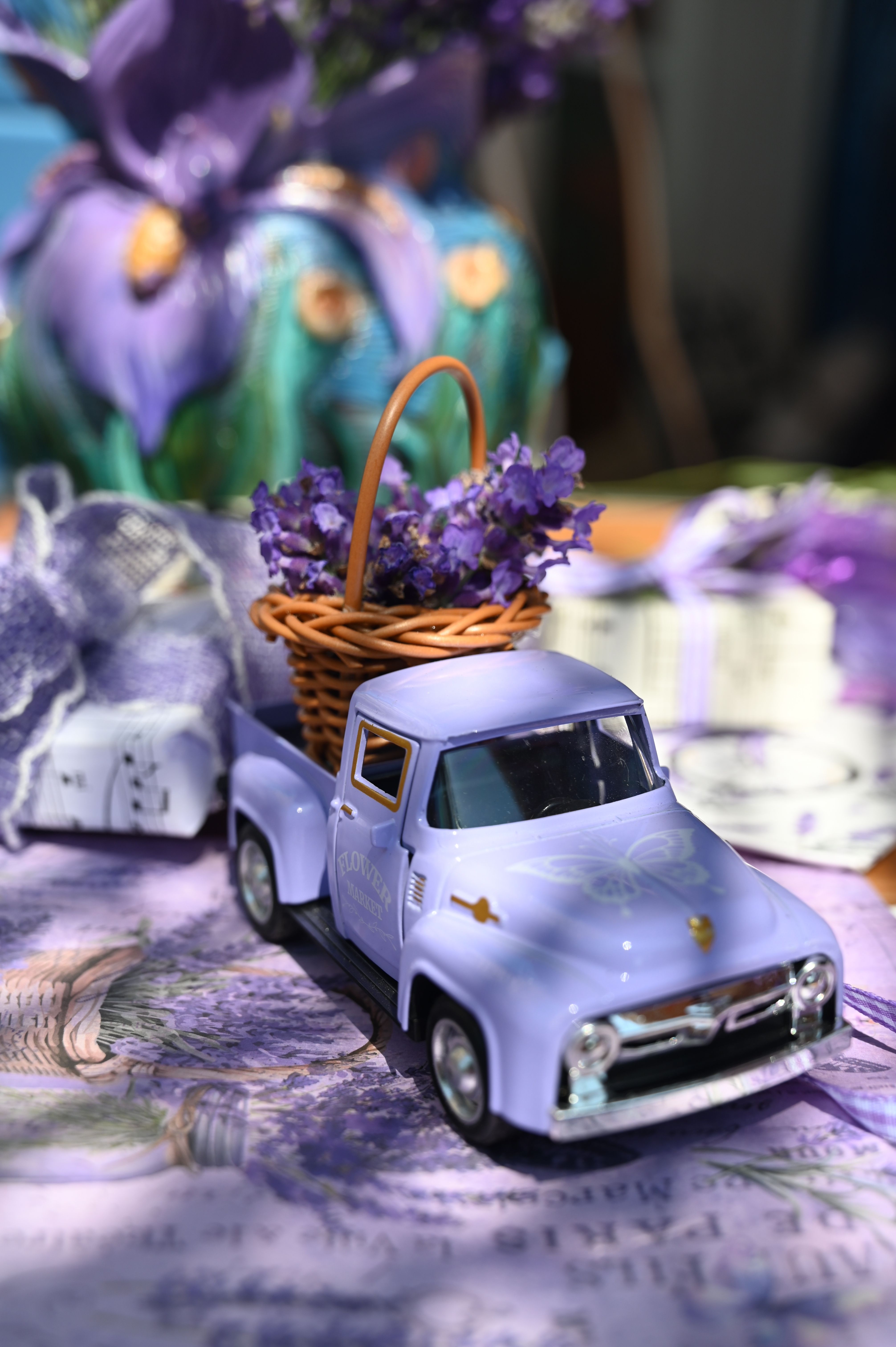 Miniature lavender arrangement in a toy truck creating a whimsical decor piece.