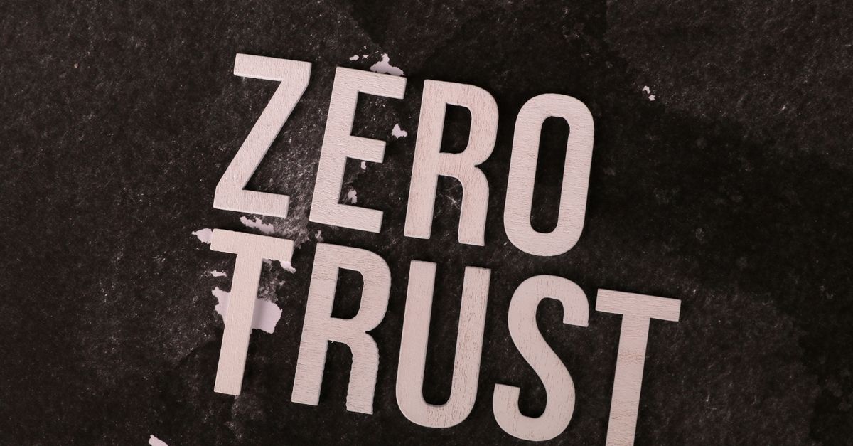 Bold 'Zero Trust' text against a textured black background, symbolizing cybersecurity.