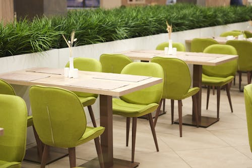 Free Wooden Table With Green Chairs Stock Photo