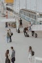 From above of anonymous people in casual wear in subway platform near train