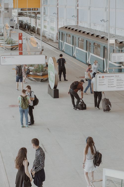 Free From above of anonymous people in casual wear in subway platform near train Stock Photo