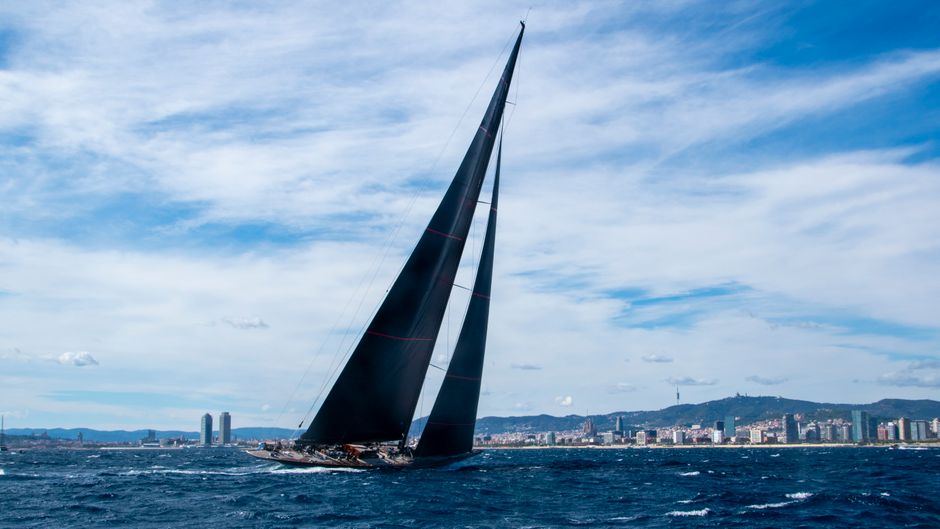 Unforgettable Tenerife Ecoyacht Tour for Whale Watching Review: An Unforgettable Eco-Luxury Experience Review 2026 - A sleek sailing yacht glides off the Barcelona coast under a clear blue sky.