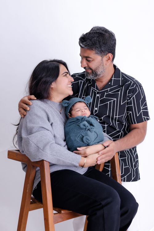 Free A loving family with newborn baby in cozy indoor setting. Stock Photo