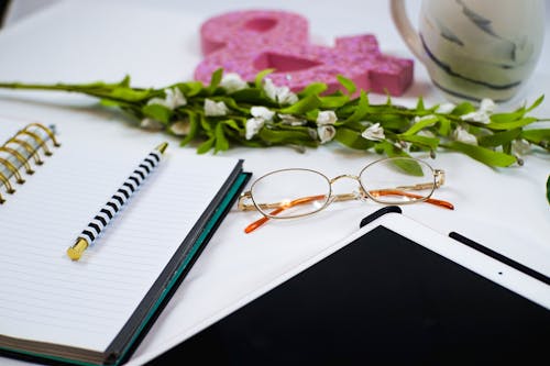 Eyeglasses near Notebook