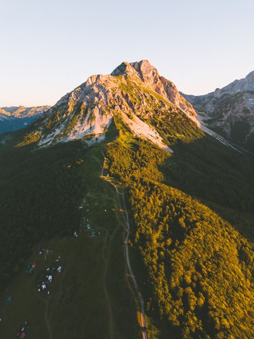 Free Breathtaking aerial shot of a lush mountainous landscape during sunset, showcasing vibrant natural beauty. Stock Photo